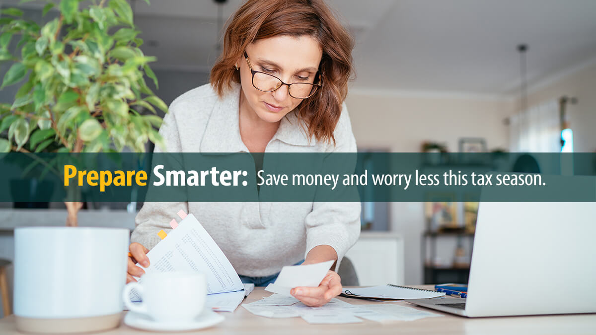 Beautiful middle-aged woman in glasses gazing at documents at home living room office.
